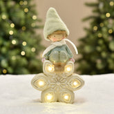 Figurine de Noël Garçon à bonnet vert sur Flocon LED